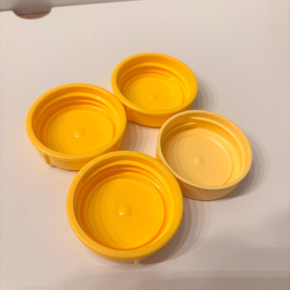 Medela Yellow Bottle Caps for Breast Milk Storage Containers‎ Set of 4